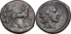 Sicily. Katane. AR Tetradrachm, c. 435-412 BC. Obv. Charioteer, wearing long chiton, holding kentron and reins, driving slow quadriga right. Rev. Head...