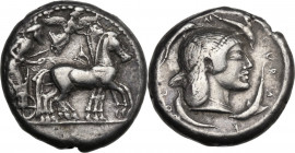 Sicily. Syracuse. Deinomenid Tyranny (485-466 BC). AR Tetradrachm, c. 485-479 BC. Obv. Charioteer, holding kentron and reins, driving walking quadriga...