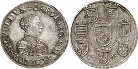 FRANCE FÉODALE
Lorraine, Charles III (1545-1608). Thaler 1557, Nancy.
Av. Buste cuirassé à droite. Rv. Ecu de Lorraine couronné, entouré de sept écu...