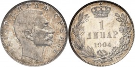 SERBIE
Pierre I (1903-1918). 1 dinara 1904.
Av. Tête nue à droite. Rv. Valeur surmontée d’une couronne. Km. 25.1. 5,00 grs. 
NGC PF 64. Rare sur fl...