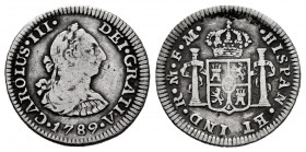 Charles III (1759-1788). 1/2 real. 1789. México. FM. (Cal-218). Ag. 1,69 g. Posthumous issue. Scarce. Choice F. Est...25,00. 

Spanish Description: ...