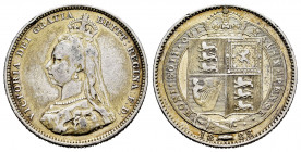 Great Britain. Victoria Queen. 1 shilling. 1888/7. (Km-761). Ag. 5,58 g. Overdate. Minor nick on edge. Gold-plated. VF. Est...50,00. 

Spanish Descr...