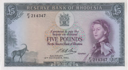 Rhodesia, 5 Pounds, 1964, AUNC(-), p26a
Queen Elizabeth II. Potrait, There is a cut in the lower left corner.
Estimate: USD 1400-2800