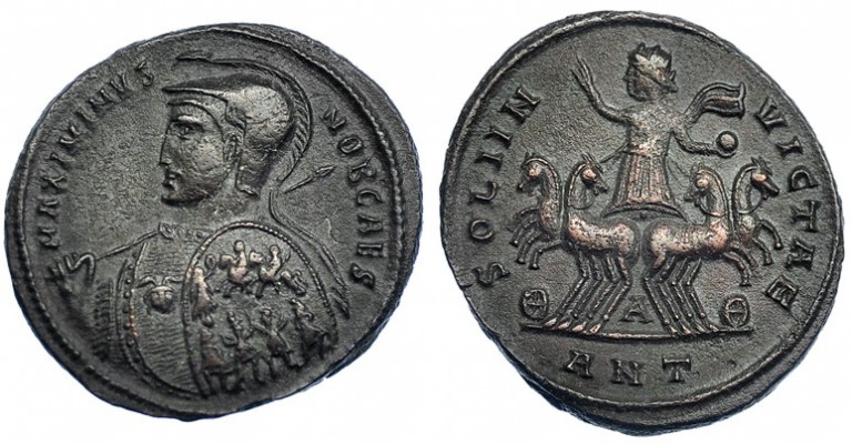 MAXIMINO II. Follis. Antioquía (310). A entre las patas de los caballos. R/ SOLI...