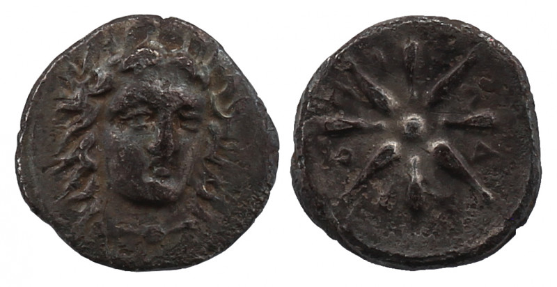 Satraps of Caria, Pixodaros AR 1/4 Drachm. Circa 341-335 BC. 

Obv: Laureate hea...