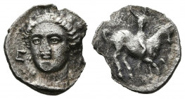 EMPORION (Ampurias, Gerona). Obolo. (Ar. 0,51g/10mm). Siglo V a.C. (ca.). (FAB-1084). Anv: Cabeza femenina ligeramente a izquierda, entre E-M. Rev: Ji...