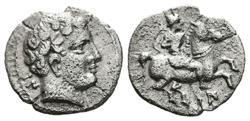 DIVISORES DE IMITACION EMPORITANA. Hemióbolo. (Ar. 0,47g/10mm). Anv: Cabeza masc...