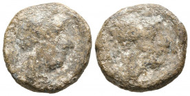 INCIERTO. Plomo monetiforme. (Pb. 5,91g/17mm). (CCP-5). Anv: Cabeza con casco a derecha. Rev: Cabeza con casco a dereca. MBC-. Raro.