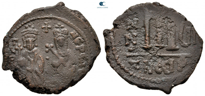 Phocas, with Leontia AD 602-610. Theoupolis (Antioch)
Follis or 40 Nummi Æ

3...
