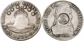 Resello F7º bajo corona sobre 8 soles de Bolivia, Potosí JM de 1829. (Kr. 51). 26,78 g. Bonita pátina. MBC+.