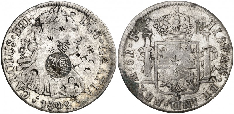 Resello F7º bajo corona sobre 8 reales de México F(T) de 1802. 26,81 g. Pequeños...