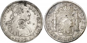 Resello F7º bajo corona sobre 8 reales de México TH de 1804. (Kr. 63). 26,86 g. Pequeños resellos orientales. Rara. MBC.