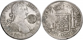 Resello (falso) F7º bajo corona sobre 8 reales de México TH de 1809, busto imaginario. 26,77 g. MBC.