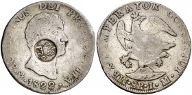 Resello F7º bajo corona sobre 8 reales de México, México JM de 1822 de Iturbide. (Kr. 72, mismo ejemplar). 26,61 g. Rara. MBC-.