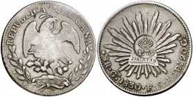 Resello F7º bajo corona, en reverso, bajo corona sobre 8 reales de México, Guadalajara FS de 1830. (Kr. 74). 26,84 g. MBC.