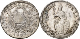 Resello F7º bajo corona, en reverso, sobre 8 reales de Perú, Lima MM de 1833. (Kr. 83). 26,85 g. MBC.
