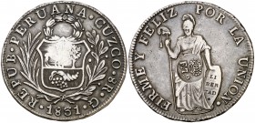 Resello F7º bajo corona, en reverso, sobre 8 reales de Perú, Cuzco G de 1831. (Kr. 84). 27,16 g. Pátina. Escasa. MBC+.