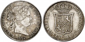 1867. Isabel II. Manila. 40 céntimos de escudo. (Barrera 789). 4 g. Falsa de época en latón plateado. La ceca de Manila no emitió este valor. Flores d...