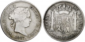 1867/57. Isabel II. Manila. 50 centavos. (Sobrefecha que falta en Calicó y Basso). 12,73 g. Leves golpecitos. Ligera pátina. Muy rara. BC+/MBC-.