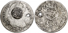 Isabel II. Resello (falso) YII bajo corona, sobre 2 reales de Madrid JD de 1784. 5,50 g. Perforación. BC+.