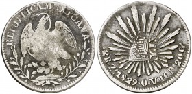 Isabel II. Resello YII bajo corona, en reverso, sobre 2 reales de México, Zacatecas OV de 1829. (Kr. 88). 7 g. Rara. MBC-.