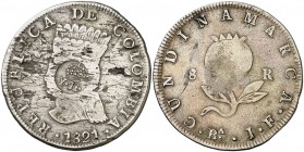 Isabel II. Resello (falso) YII bajo corona sobre 8 reales de Colombia, Cundinamarca JF de 1821. 21,05 g. Hojitas. Rara. (BC+).