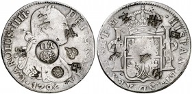 Isabel II. Resello (falso) YII bajo corona sobre 8 reales de México FM de 1796. 24,05 g. Además, dos resellos de Tailandia y varios resellos orientale...