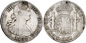 Isabel II. Resello (falso) YII bajo corona, sobre 8 reales de México TH de 1807. 26,64 g. Resello aplicado sobre ambas caras simultáneamente, en el mi...