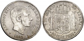 1883. Alfonso XII. Manila. 50 centavos. (Cal. 83) (Basso 66 var). 12,80 g. Fecha ligeramente regrabada. Rayitas y golpecitos. MBC/MBC+.