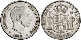 1885/1. Alfonso XII. Manila. 50 centavos. (Cal. 85 var) (Basso 66 var). 12,89 g. Golpecitos. Rara rectificación. MBC-.