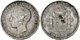1897. Alfonso XIII. Manila. SGV. 1 peso. 24,81 g. Dos resellos orientales grandes, raros sobre esta moneda. Golpecitos en canto. (MBC).