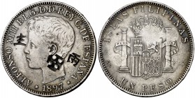 1897. Alfonso XIII. Manila. SGV. 1 peso. 24,81 g. Tres resellos orientales grandes, raros sobre esta moneda. MBC.