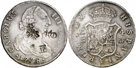 1778. Carlos III. Sevilla. CF. 4 reales. 13,28 g. Resellos orientales grandes en anverso. Rara. MBC.