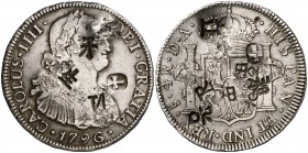 1796. Carlos IV. Santiago. DA. 4 reales. 13,48 g. Resellos orientales grandes, muy raros sobre esta moneda. Ex Áureo 17/04/2002, nº 916. MBC+.