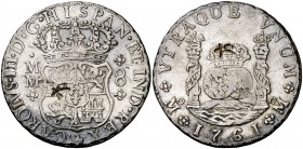 1761. Carlos III. México. MM. 8 reales. 26,59 g. Columnario. Dos resellos orientales grandes. Ex Áureo 28/04/2004, nº 542. MBC.