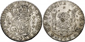 1766. Carlos III. México. MF. 8 reales. 27 g. Columnario. Resellos orientales. Buen ejemplar. MBC+.
