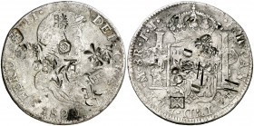 1820. Fernando VII. México. JJ. 8 reales. 26,43 g. Resellos orientales grandes. MBC.
