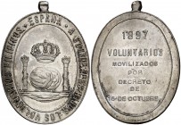 1897. Alfonso XIII. Distinción a los Voluntarios Filipinos. (Pérez Guerra 774). 25,78 g. Plata. Ovalada, 47x35 mm. Con anilla. Muy rara. EBC.