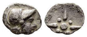 TROAS.Kolone.(4th century BC).Obol.

Obv : Helmeted head of Athena right.

Rev : Stellate pattern in linear square within incuse square.
SNG Arikantür...
