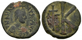 ANASTASIUS I.(491-518). Antioch.Ae.

Obv : DN ANASTASIV PP.
Diademed, draped and cuirassed bust right.

Rev : Large K; to left cross dividing AN/ТX; t...