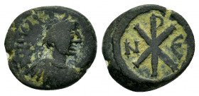 JUSTIN I.(518-527).Constantinople.Ae.

Obv : DN IVSTINVS PP AVG.
Diademed, draped and cuirassed bust of Justin I right.

Rev : large epsilon, star to ...