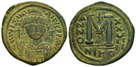 JUSTINIAN I.(527-565).Nikomedia.Ae.

Obv : D N IVSTINIANVS P P AVG.
elmeted and cuirassed bust facing, holding globus cruciger and shield decorated...