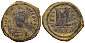 JUSTINIAN I.(527-565).Nicomedia.Ae.

Obv : D N IVSTINIANVS P P AVG.
Helmeted and cuirassed bust facing, holding globus cruciger and shield; cross to r...