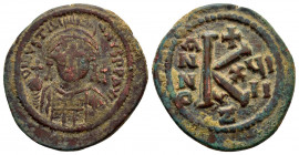 JUSTINIAN I.(527-565).Cyzicus.Ae.

Obv : D N IVSTINIANVS P P AVG.
Helmeted and cuirassed facing bust, holding globus cruciger and decorated shield;...