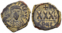 PHOCAS.(602-610).Constantinople.Ae.

Obv : δN FOCAS PЄRP AVC.
Crowned, draped, and cuirassed bust facing, holding globus cruciger.

Rev : Large XXX; c...