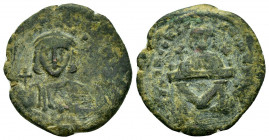 LEO III with CONSTANTINE V.(717-741).Constantinople.Follis.

Obv : Crowned and draped facing bust of Leo, holding globus cruciger and akakia.

Rev : C...