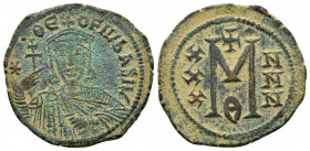 THEOPHILUS.(829-842).Constantinople.Ae.

Obv : ✷ • ΘЄOFIL ЬASIL.
Crowned facing bust, holding cross potent and akakia .

Rev : Large M; X/X/X to left,...