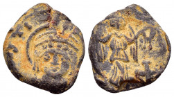 BYZANTINE LEAD SEAL.JUSTINIAN I.(527–65).Pb.

Obv : Nimbate, beardless bust of Justinian I, facing forward, wearing both a helmet with diadem, trefoil...