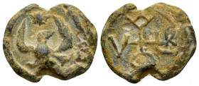 BYZANTINE LEAD SEAL.(Circa 11 th Century).Pb.

Obv : An eagle with its wings outspread. A star above. Wreath border.

Rev : Cruciform invocative monog...