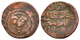 ARTUQID of MARDIN.Najm al-Din Ghazi II.(1298-1299). AH 698.Ae.

Obv : Stylized sun-face within double circle, pellets in between rays.

Rev : Arabic l...